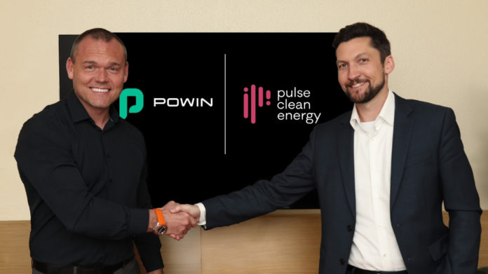 Powin President Anthony Carroll and Pulse Clean Energy CEO Trevor Willis shake hands after signing the partnership agreement.